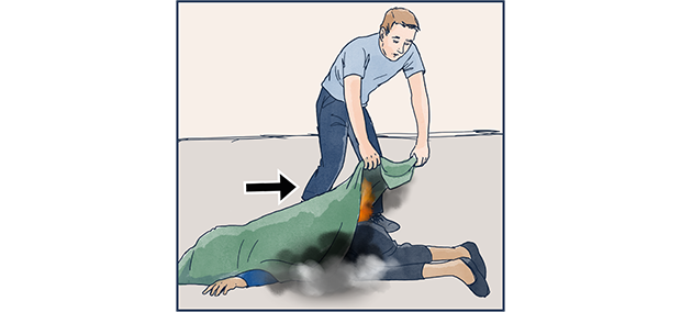 Illustation där en person med brandfilt kväver brand i kläder på en person som ligger ner.